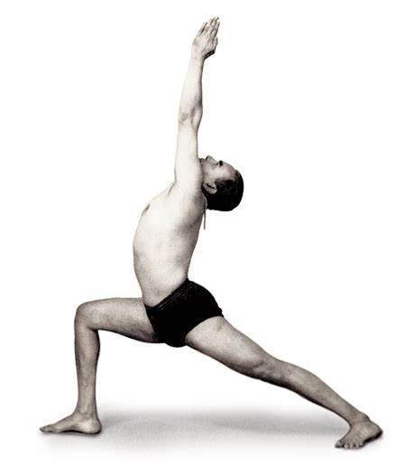 B. K. S. Iyengar doing Warrior 1 yoga pose